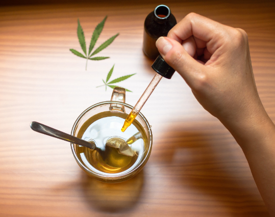 CBD oil being added to tea