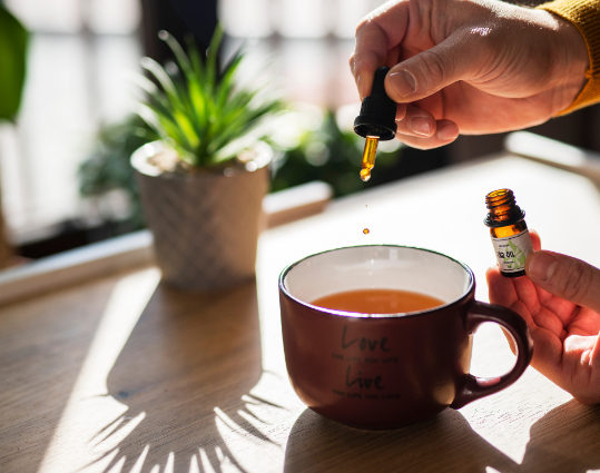 CBD oil being added to tea